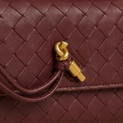 Bottega Veneta Andiamo Clutch Burgundy — gold knot close-up